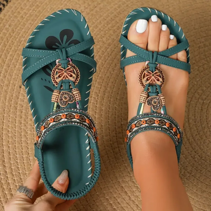 Women's stylish flat T-strap sandals, perfect for daily wear & summer comfort.