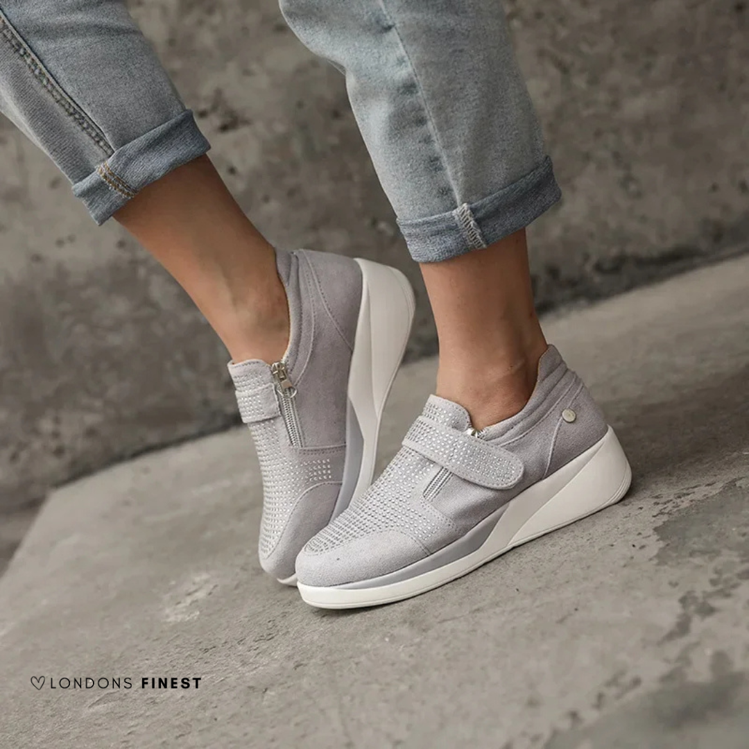 Cushioned women's sneakers with arch support and adjustable straps for ultimate comfort & long walks.