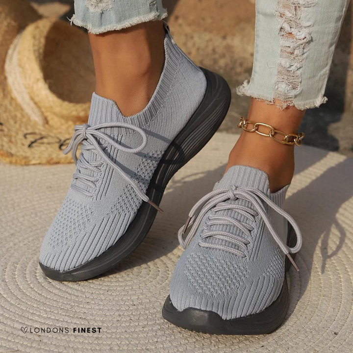 Lightweight women's walking sneakers in white with breathable design, perfect for casual everyday wear & active support.