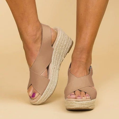Women's supportive wedge sandals for summer comfort. Ergonomic, open-toe style perfect for casual walking footwear.