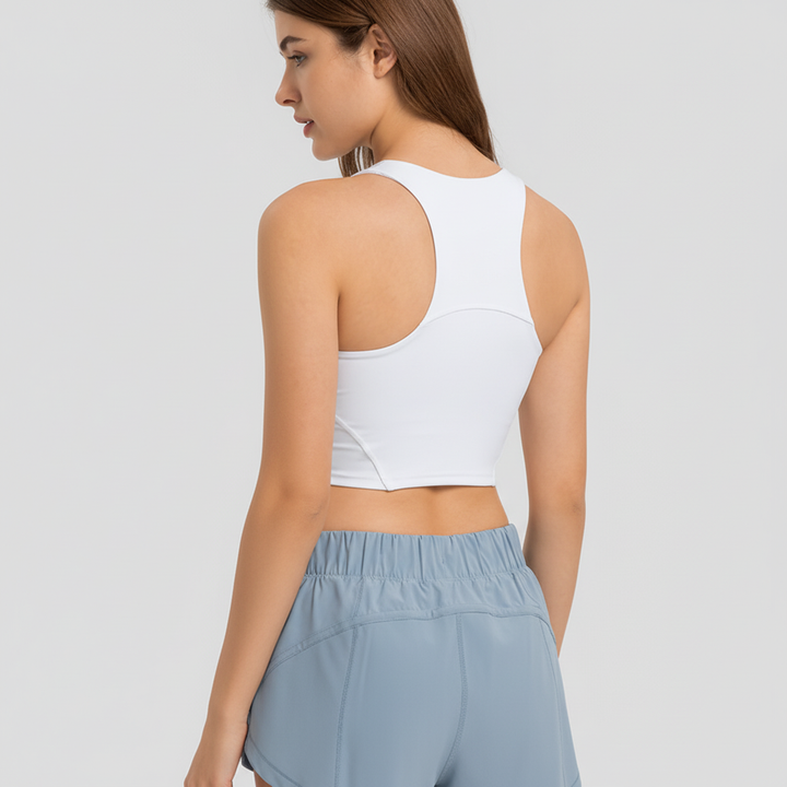 Women's supportive fitness top with removable pads, racerback design for ultimate gym comfort.