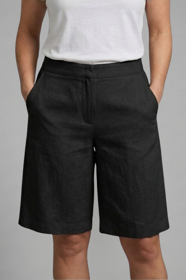 Elegant women's tailored shorts, flat front and wide leg. Knee-length for a chic, versatile summer look.