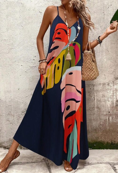 Long tropical leaf pattern sleeveless maxi dress for women, ideal for beach, summer, and vacation fashion.