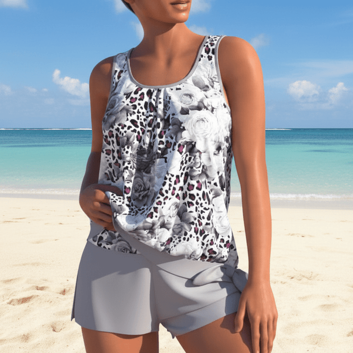Detailed view of women's two-tone floral tankini top and bottom, premium swimwear for summer.