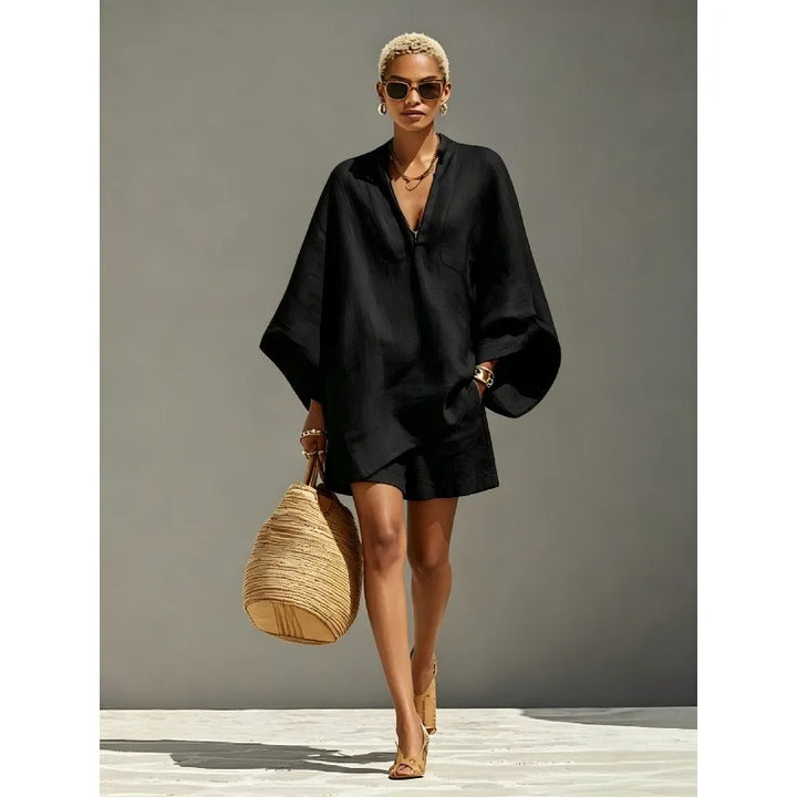 Relaxed fit women's two-piece V-neck batwing sleeve shorts set. Ideal for summer fashion, lounging, or vacation outfits.