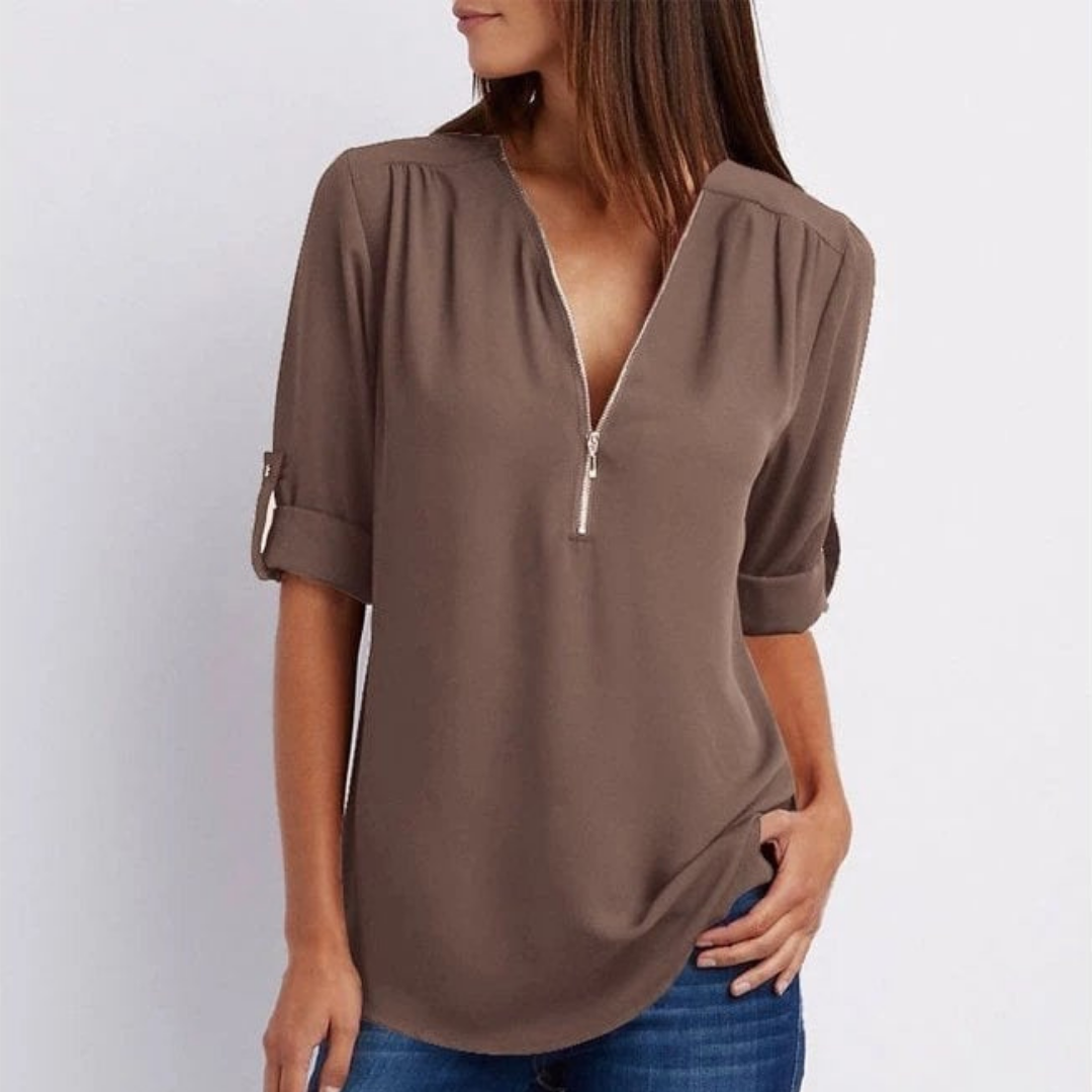 Chic women's long sleeve V-neck blouse with functional zip & adaptable roll-up sleeves for spring fashion.
