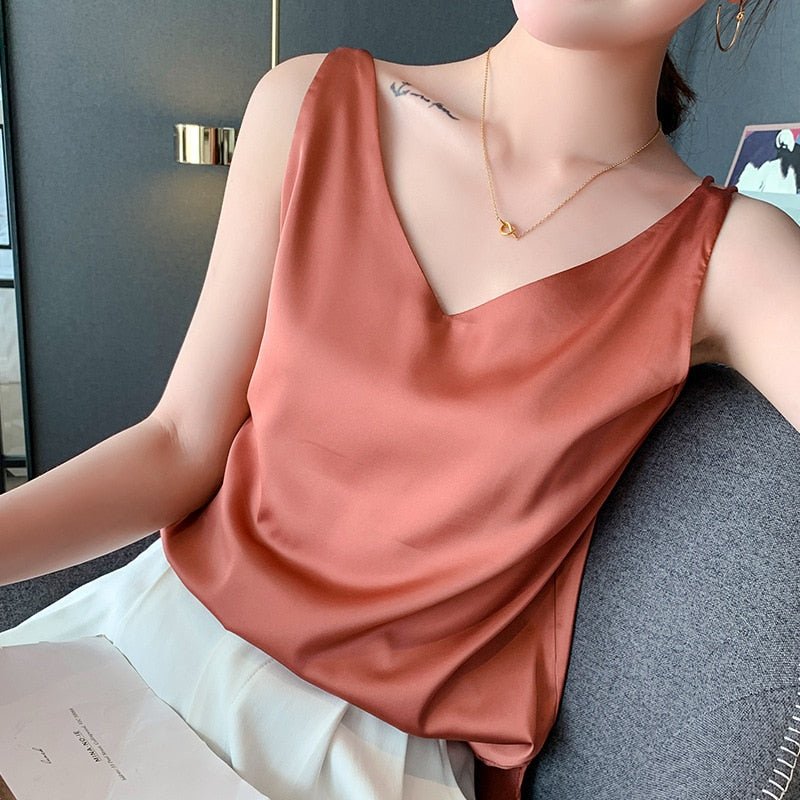 Sleek V-neck women's tank blouse, a loose fit top perfect for stylish summer wear and warm weather.