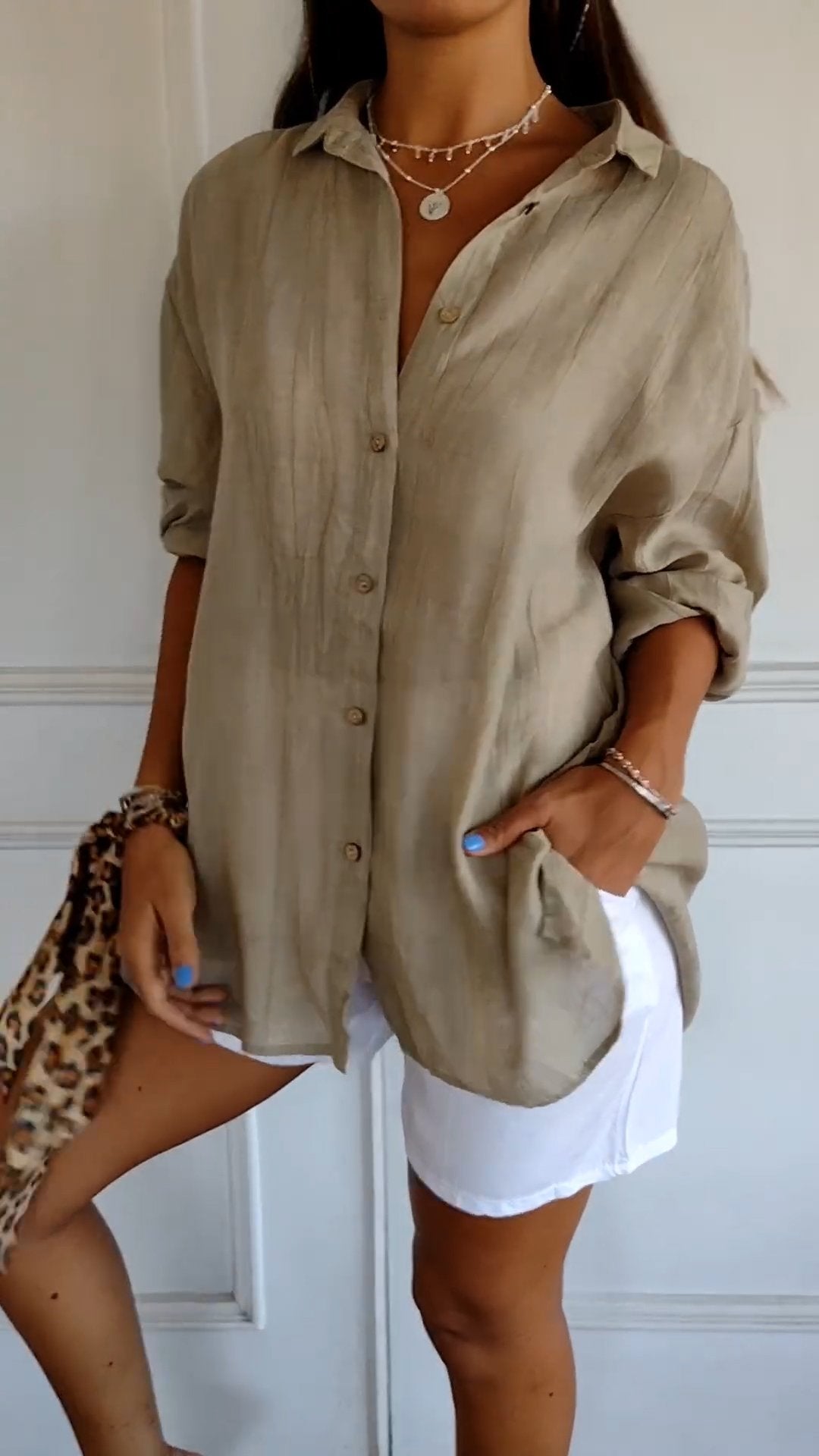 Chic women's versatile long sleeve button-down shirt, ideal for spring, summer fashion, or beach cover-up.