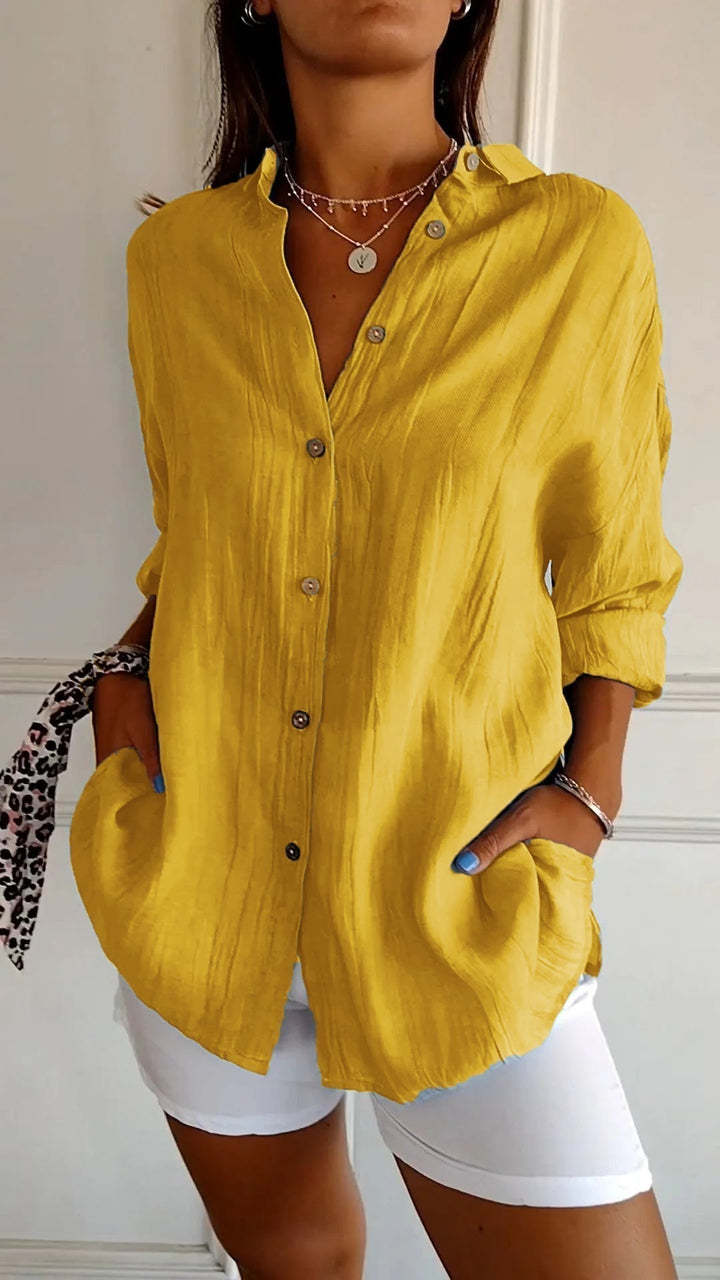 Comfortable women's long sleeve button-down shirt, a versatile casual top for everyday spring wear.