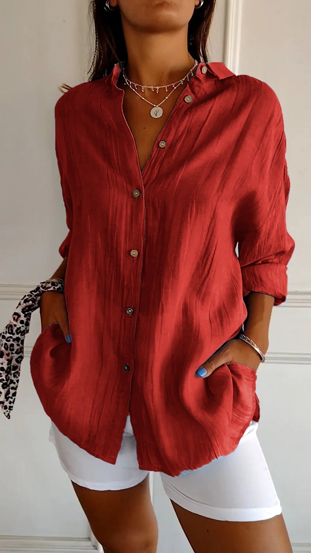 Stylish women's long sleeve button-down shirt, perfect for layering or as a relaxed summer top.