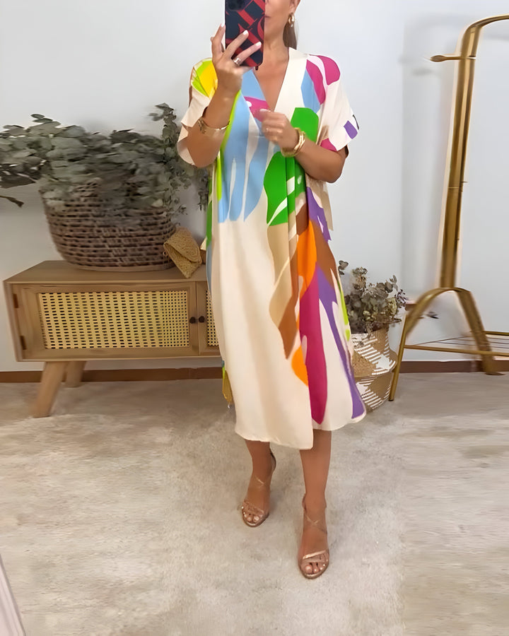 Colorful women's abstract print V-neck shift dress, vibrant design for spring & summer fashion.