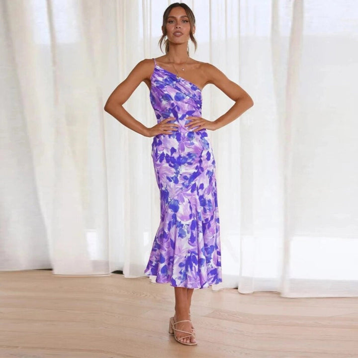 Daytime chic women's floral midi dress, sleeveless, vibrant pattern, and elegant asymmetric hem.