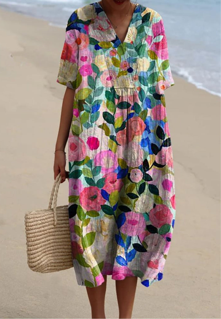 Women's vibrant floral garden print flowy midi dress, perfect for summer casual wear or elegant spring events.