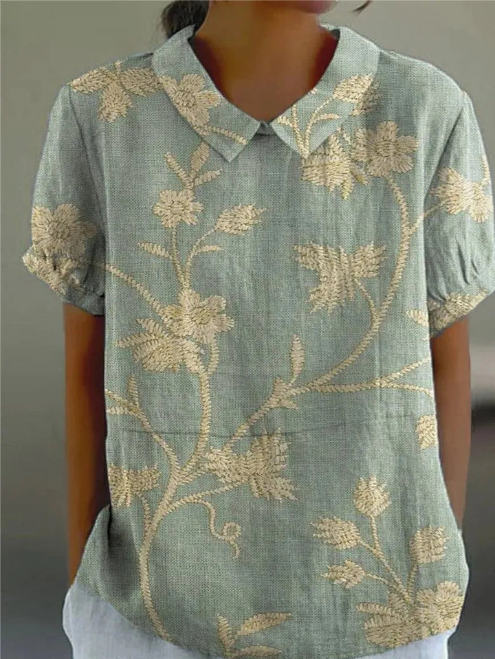 Women's vintage floral collared short sleeve blouse, a charming top for spring casual wear and summer fashion.