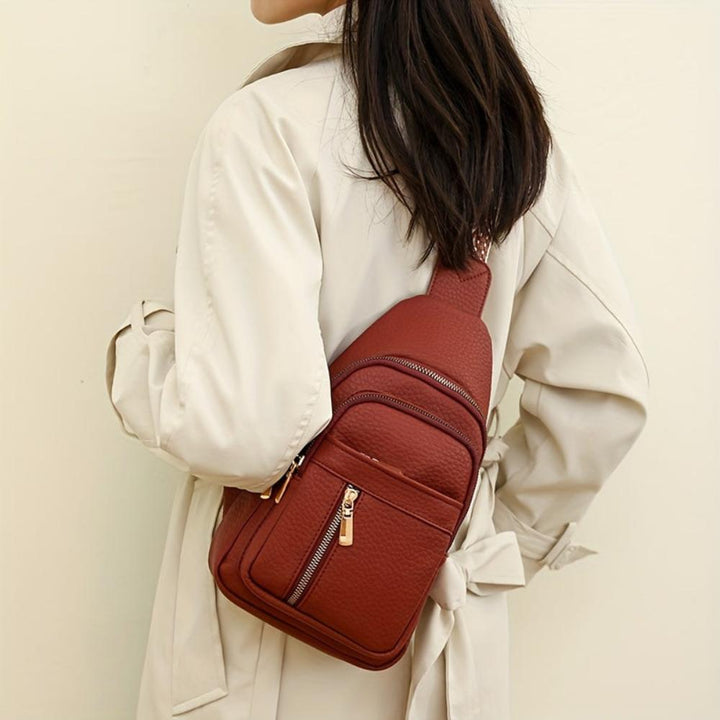 Black women's vintage crossbody bag, sleek design for daily use & events.