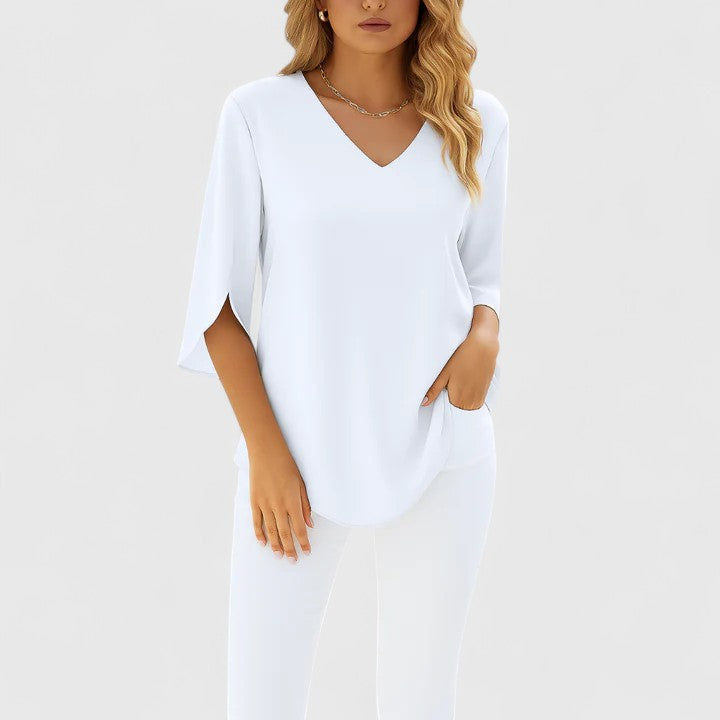 Stylish women's Violetta V-neck blouse offering a sophisticated, relaxed fit for versatile summer elegance.