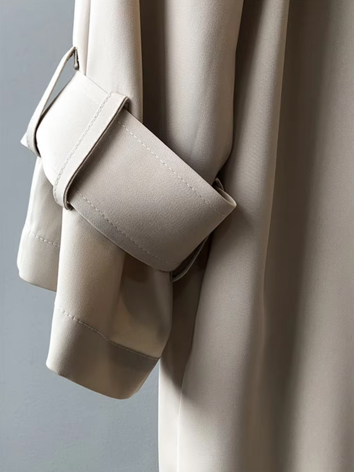 Stylish women's double-breasted trench coat, waterproof outerwear for versatile spring & fall fashion.