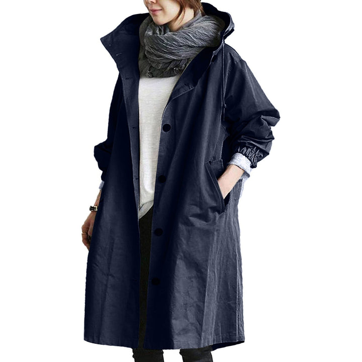 Elegant women's waterproof trench coat, a long stylish outerwear for all-weather protection and outdoor style.