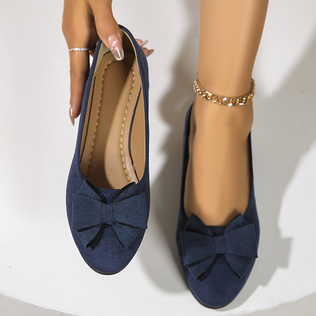 Ladies comfortable wedge ballet flats, featuring a charming bow and round toe for everyday style.