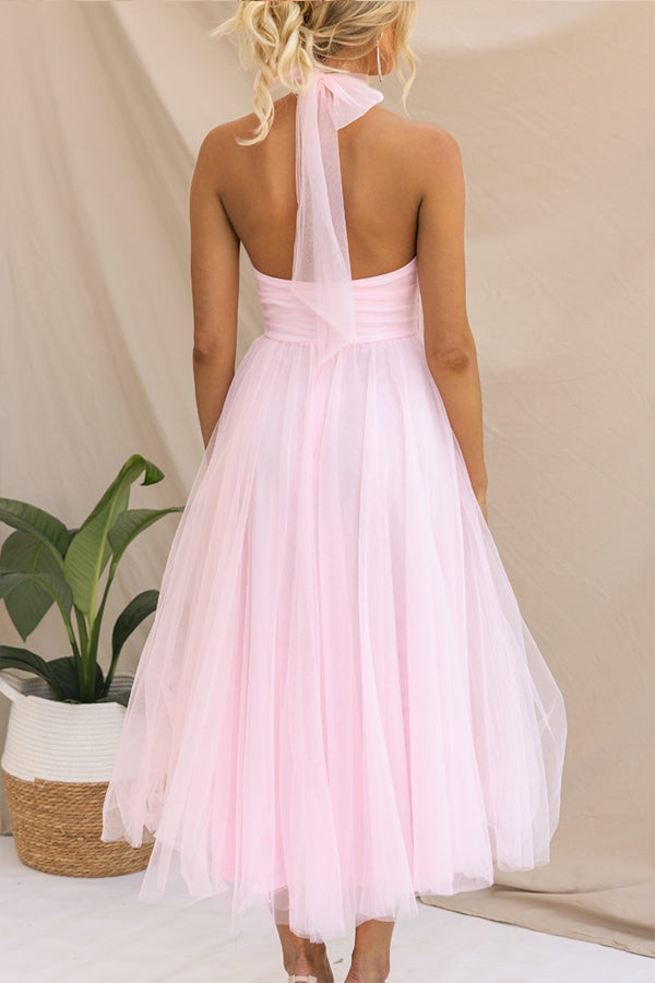 Model wearing a stunning women's elegant whimsical tulle midi dress for formal events.
