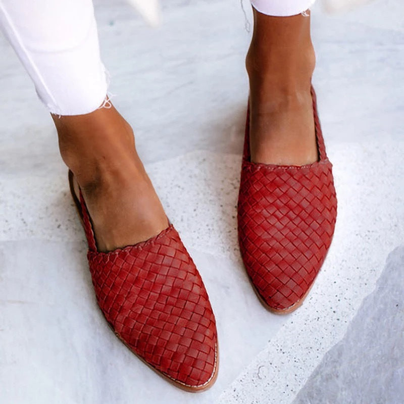 Elegant women's slip-on mules, woven closed toe design ideal for casual footwear.