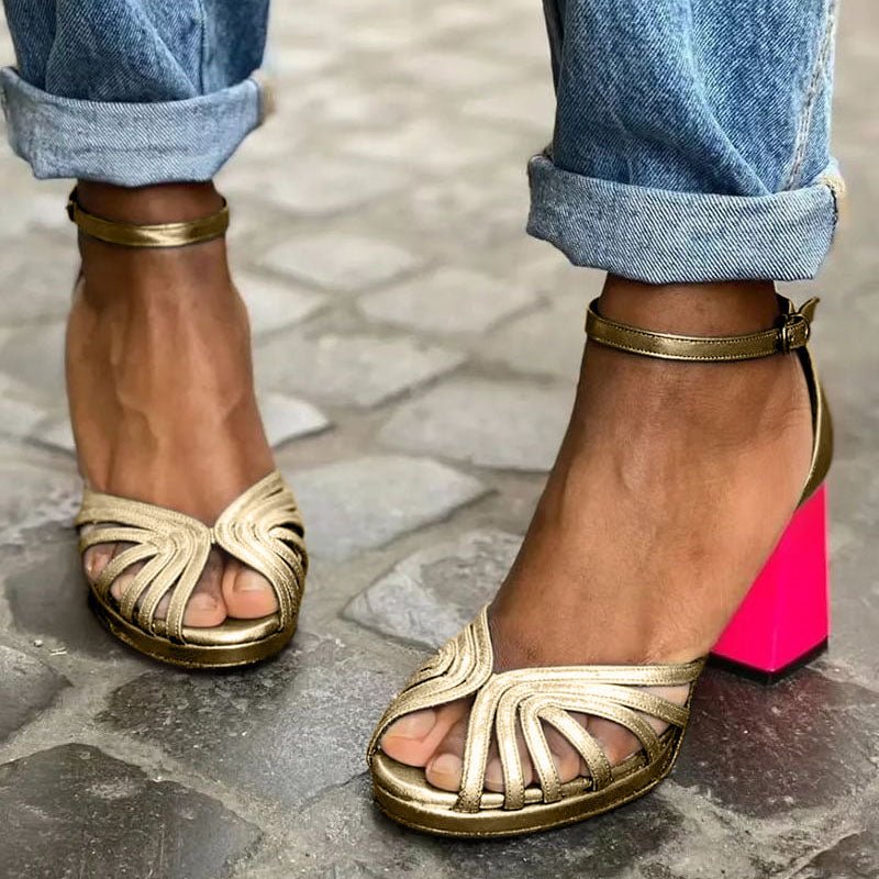Elegant women's gold block heel sandals with open toe and secure ankle strap, perfect for dressy summer style.