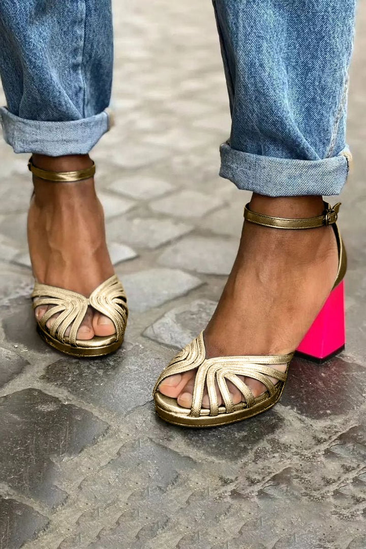Chic multi-strap gold block heel sandals for women, featuring open toe and comfortable ankle strap for evening wear.
