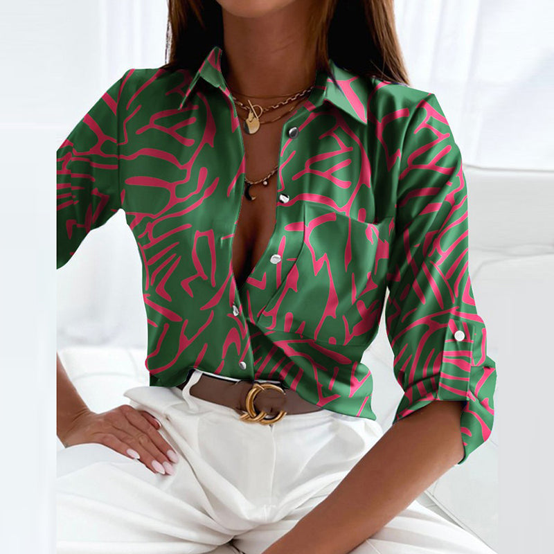 Sophisticated women's long sleeve graphic print button-down shirt. Elevates any outfit.