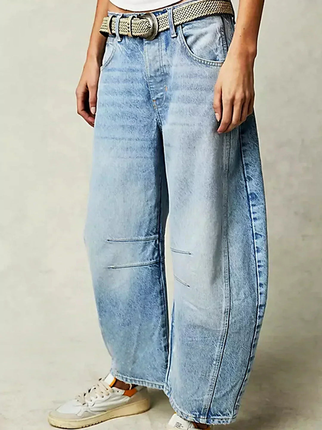 Front view of women's high-waisted wide-leg denim jeans, showcasing their flattering cut and modern style.