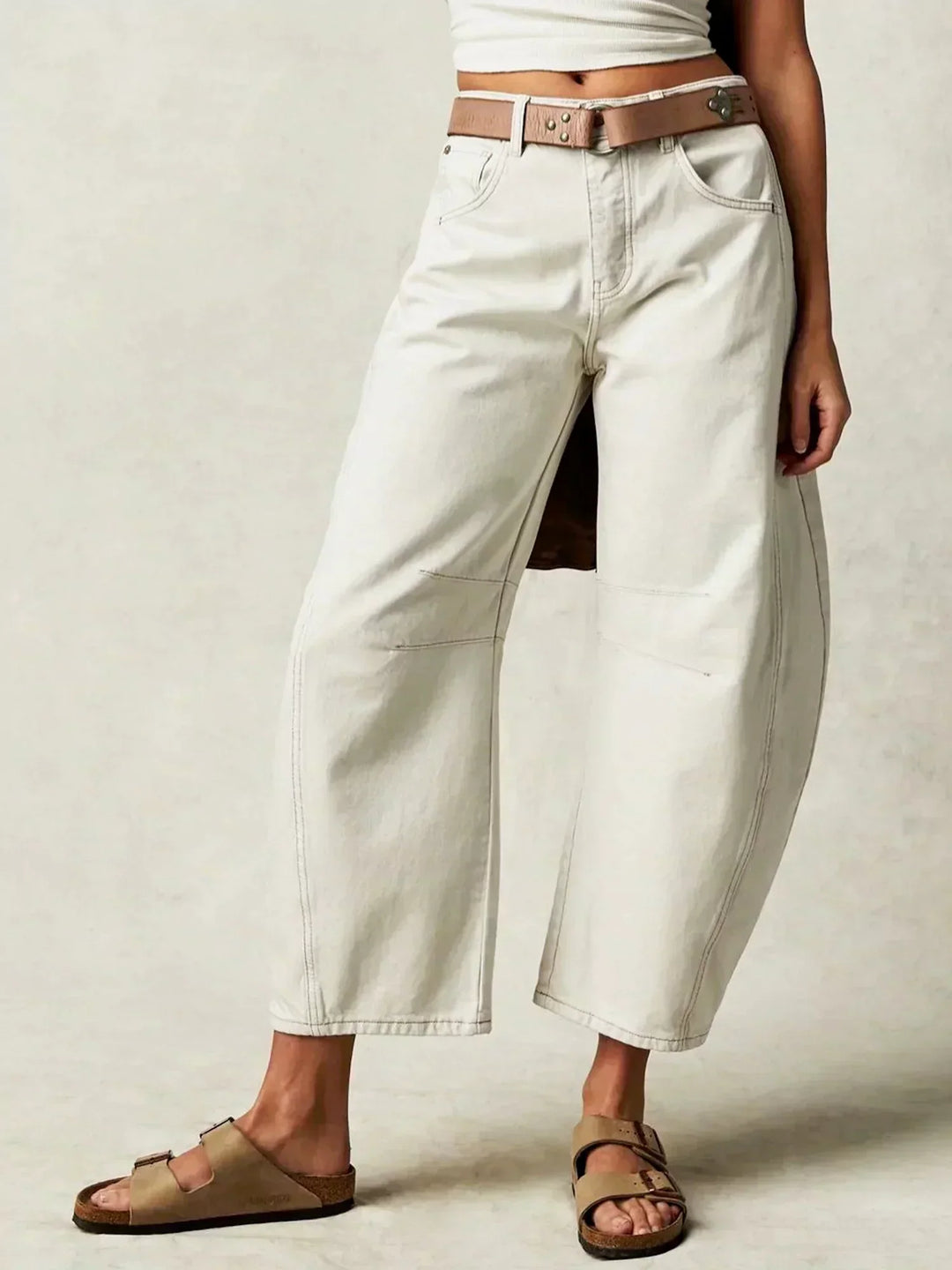 Modern women's high-waisted wide-leg jeans with a soft denim finish, perfect for trendy casual wear.