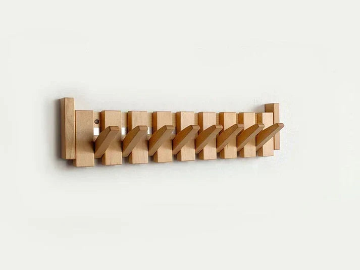Elegant piano style wall mounted coat rack with a sleek wood finish. Modern home decor & entryway storage.