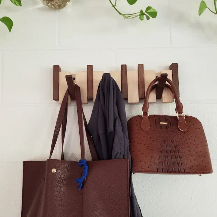 Modern piano key design wall mount coat rack. Stylish wood finish, perfect for entryway storage & organization.