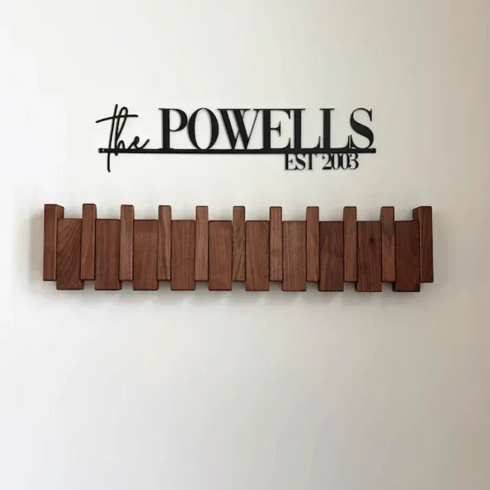 Functional piano design wall mount coat rack with wood finish. Stylish home decor & entryway organization.