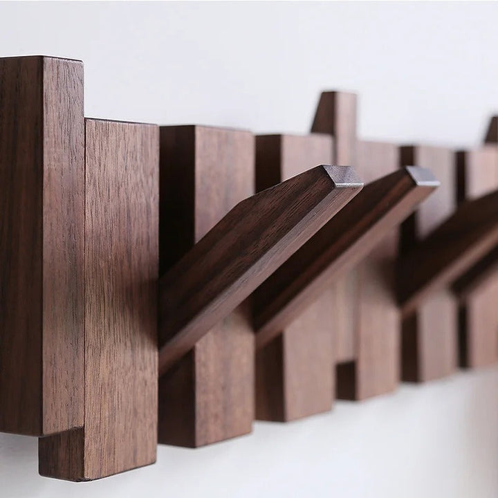 Wall mounted coat rack with unique piano key design. Functional art & stylish entryway organization in wood.